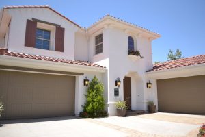 A big brown and white mansion house with garage, an example property in Modesto