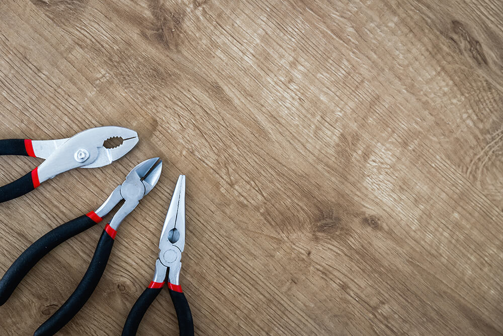 A set of tools kept on a wooden table